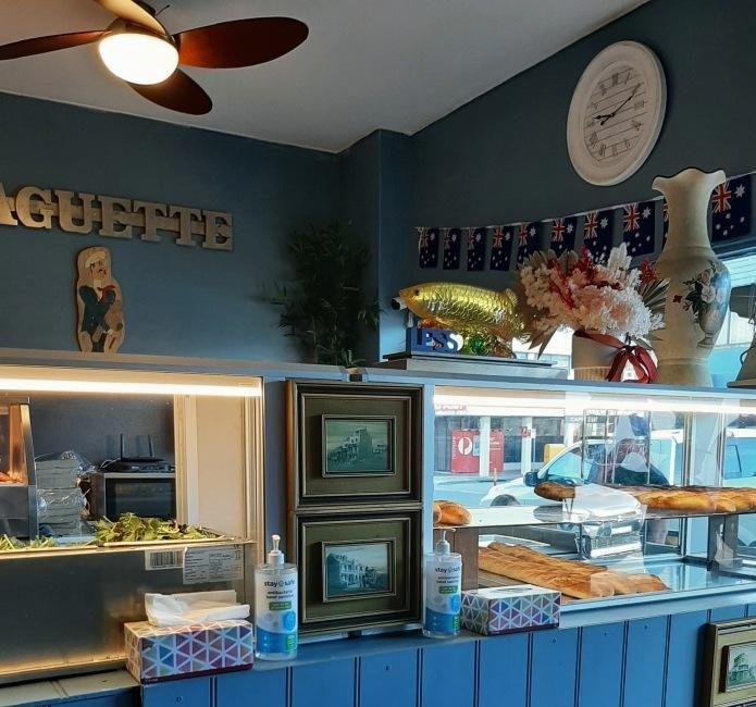 Inside Le'ss Bakery — the BAGUETTE wall