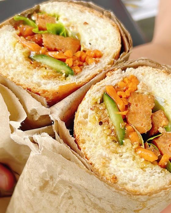 Pork banh mi roll with pickled carrot and cucumber